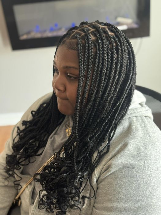 Medium box braids with soft wavy ends