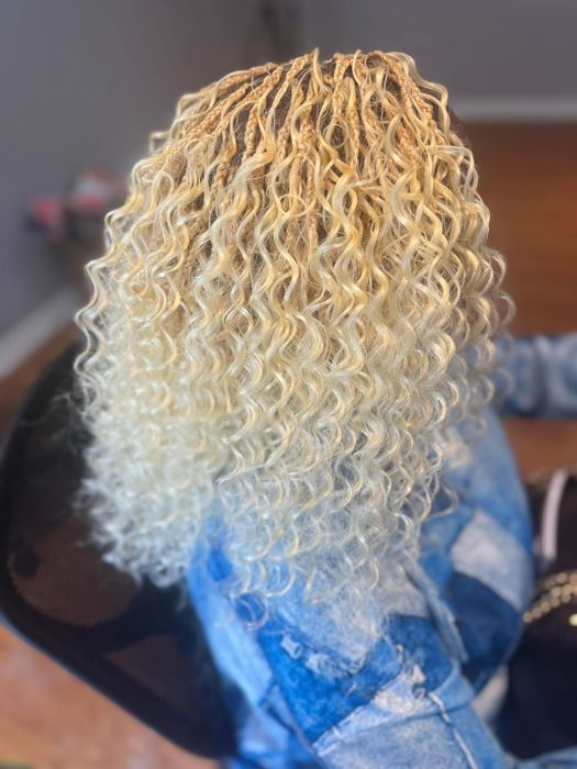 Golden blonde curly braided extensions, close-up back view