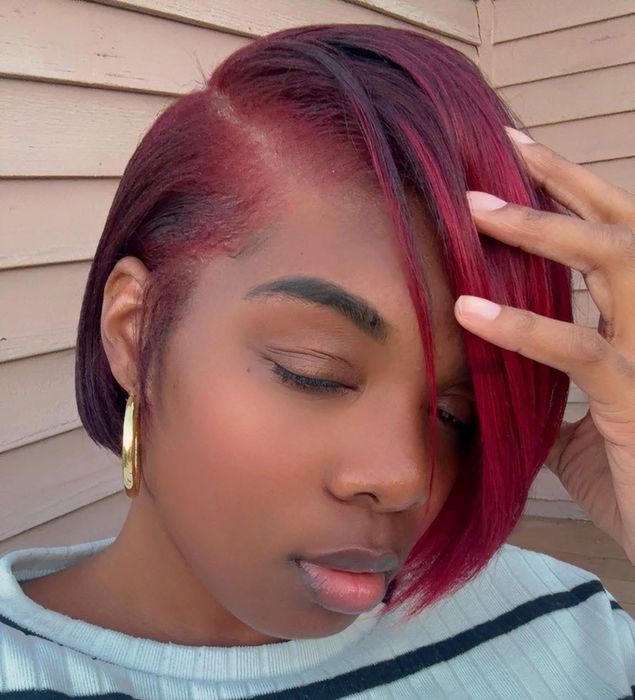 Tierra Elizabeth, owner and founder of House of Braids CT, with red-toned hair color