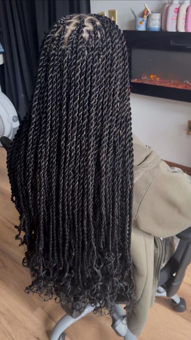 Long twists shown from the back in natural outdoor light